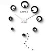 Horloge Large noire avec des cercles avec le texte Love